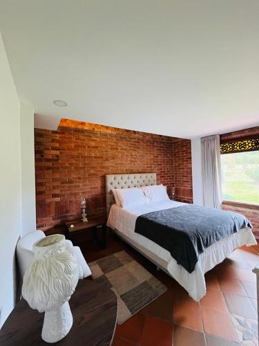 Postel nebo postele na pokoji v ubytování Hotel Caney campestre Villa de Leiva