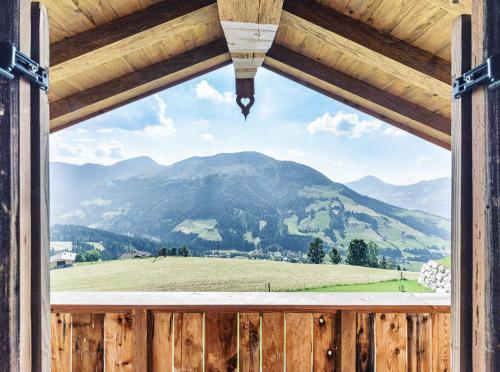 a view from a window of a mountain view at Maierl-Alm & Maierl-Chalets in Kirchberg in Tirol
