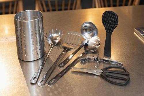 a group of kitchen utensils sitting on a table at Liendepremie讃 貸切の宿 金刀比羅宮参道まで徒歩5分 敷地内駐車場5台 in Kotohira