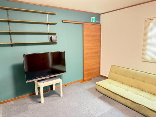 TV a/nebo společenská místnost v ubytování 宿のきむら
