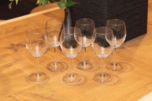 a group of wine glasses sitting on a table at Liendepremie讃 貸切の宿 金刀比羅宮参道まで徒歩5分 敷地内駐車場5台 in Kotohira