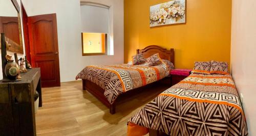 Postel nebo postele na pokoji v ubytování Hostal Café Tiana