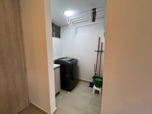 a small kitchen with a sink and a refrigerator at Apartamento de descanso y relajación en Villeta in Villeta
