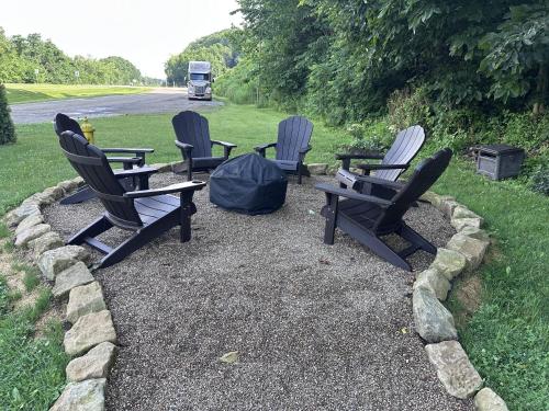 a group of chairs sitting on the side of a road at The Roscoe Boutique Motel in Coshocton