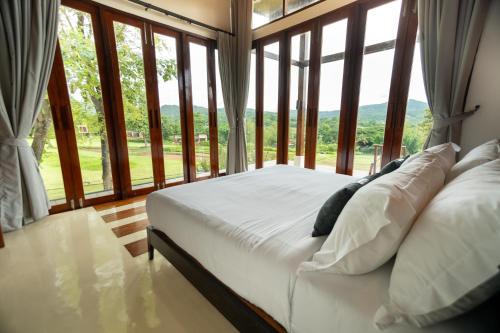 Katil atau katil-katil dalam bilik di Puripai Villa Wellness & Retreat