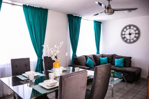 a living room with a table and a dining room at Amplio Departamento 3 Centro Historico - Wide Apartment 3 Downtown in San Luis Potosí