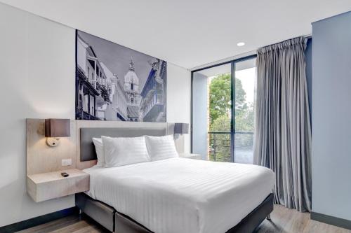 Postel nebo postele na pokoji v ubytování Home Suites 118 By gA
