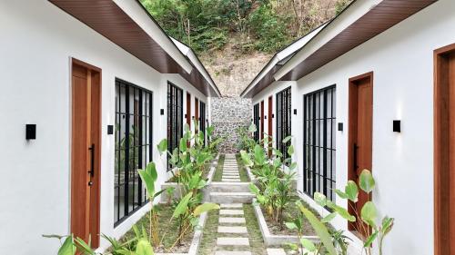 an internal courtyard of a house with plants at Malasama Suites Hotel in Kuta Lombok