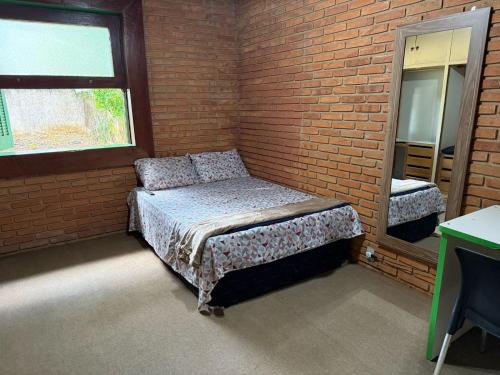 Postel nebo postele na pokoji v ubytování Quarto privado no Centro