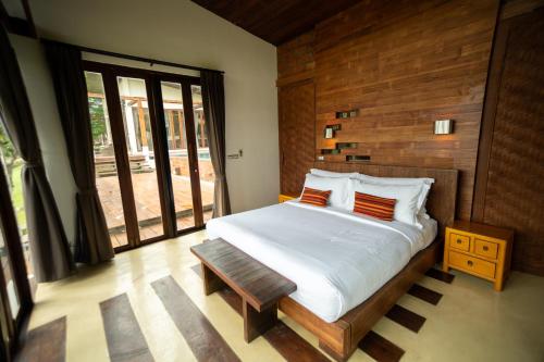Katil atau katil-katil dalam bilik di Puripai Villa Wellness & Retreat