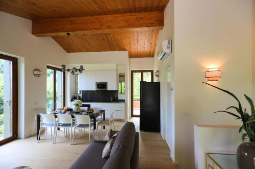 a living room with a couch and a table at Villetta Isabella in Menaggio