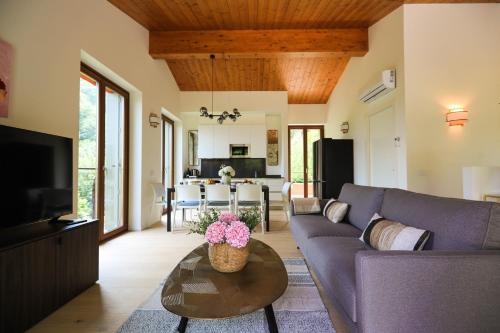 a living room with a couch and a table at Villetta Isabella in Menaggio
