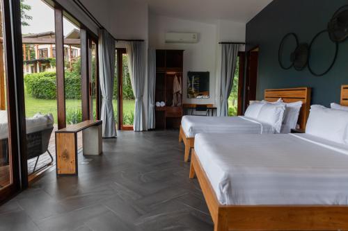 Katil atau katil-katil dalam bilik di Puripai Villa Wellness & Retreat