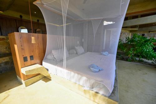 Postel nebo postele na pokoji v ubytování UtopiAmar Beach House & Suites