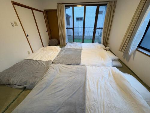 Sendai Riverside Retreatにあるベッド