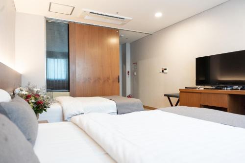 Ένα ή περισσότερα κρεβάτια σε δωμάτιο στο Silla Boutique Hotel Premium