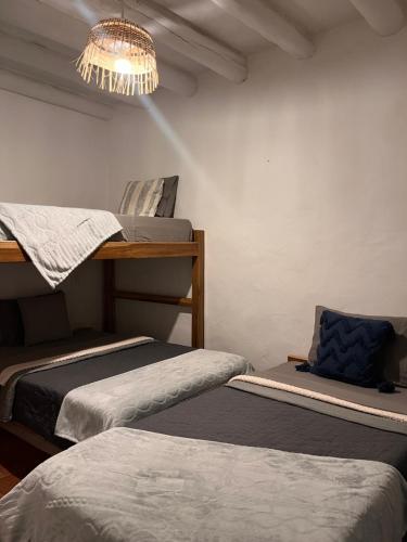 Ένα ή περισσότερα κρεβάτια σε δωμάτιο στο Casa Quintanilla Barichara