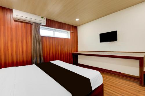Postel nebo postele na pokoji v ubytování Super Hotel O Machilipatnam
