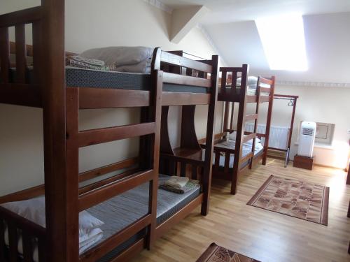 a group of bunk beds in a room at Lions Heart Hostel in Lviv