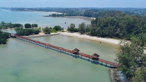 a bridge over a river with a train on it at 4-10pax BAYU BEACH 2R2B PRIVATE BEACH, WATERSPORT, Pool, Bbq, Wifi, 50"TV in Port Dickson