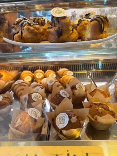 a display case in a bakery with various pastries at Affittacamere Il Cuore Verde in Norcia