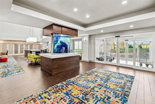 a large living room with a kitchen and a living room with a couch at Hampton Inn & Suites Corpus Christi I-37 - Navigation Boulevard in Corpus Christi