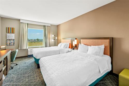a hotel room with two beds and a window at Hampton Inn & Suites Corpus Christi I-37 - Navigation Boulevard in Corpus Christi
