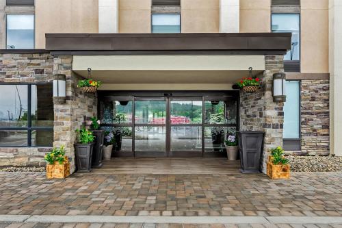 an entrance to a building with potted plants at Hampton Inn Princeton in Princeton