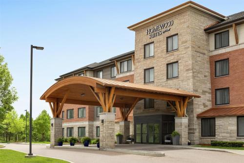a hotel with a pavilion in front of a building at Homewood Suites by Hilton Burlington in Burlington