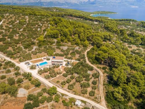 an aerial view of a house with a road at The Olive Tree Villa in Sumartin