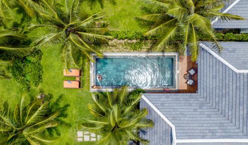Bazén v ubytování Bliss Hoi An Beach Resort & Wellness nebo v jeho okolí
