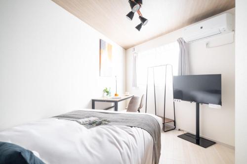 Postel nebo postele na pokoji v ubytování Bloom Kawagoe