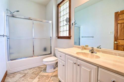 a bathroom with a sink and a toilet and a shower at 7500 - Soundscape in Manteo