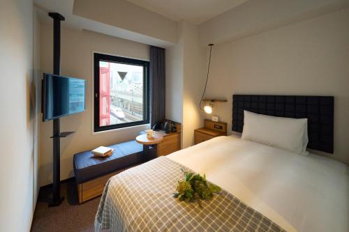 Postel nebo postele na pokoji v ubytování Hotel Resol Stay Akihabara