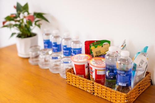 a basket full of water bottles on a table at The Sim Hotel Vung Tau in Vung Tau