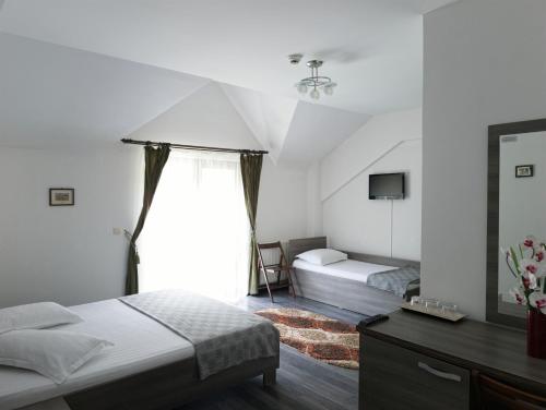 Ένα ή περισσότερα κρεβάτια σε δωμάτιο στο Eden Maison