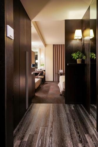 a hotel room with a corridor with a hotel suite at Solaria Nishitetsu Hotel Seoul Myeongdong - Renovated in 2025 in Seoul