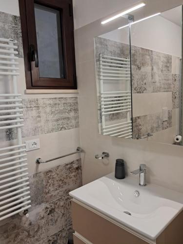 a bathroom with a sink and a mirror at Villa MARGHERITA in Pratola Peligna
