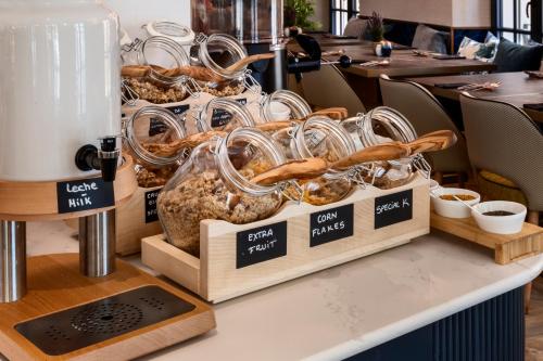 a display of breads and pastries on a table at Catalonia Puerta del Mar in Málaga
