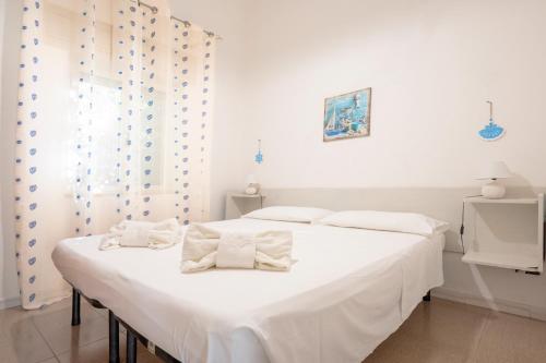 Ένα ή περισσότερα κρεβάτια σε δωμάτιο στο Agriturismo Alimini a Otranto