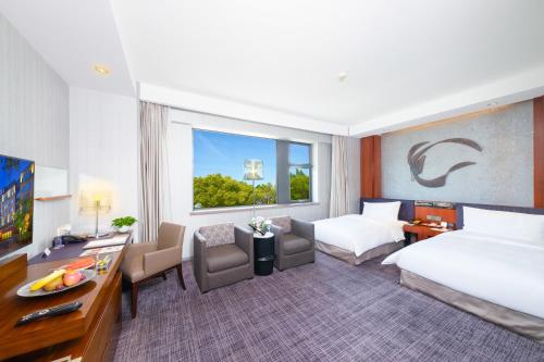 Ένα ή περισσότερα κρεβάτια σε δωμάτιο στο Shanghai Zhangjiang Parkyard Hotel - Free shuttle bus from the New International Expo Center during the exhibition