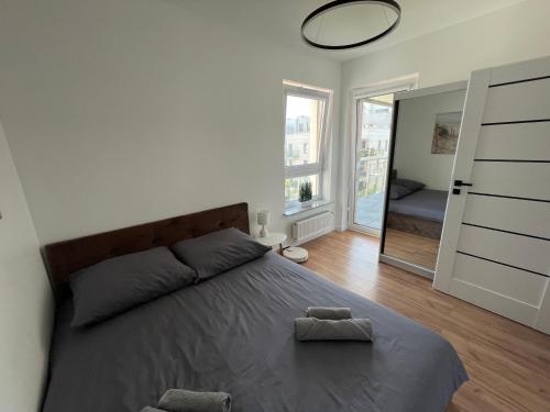 Ένα ή περισσότερα κρεβάτια σε δωμάτιο στο La Masuria Apartment