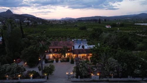 an aerial view of a house with a sunset at Villa Christina in Tolo