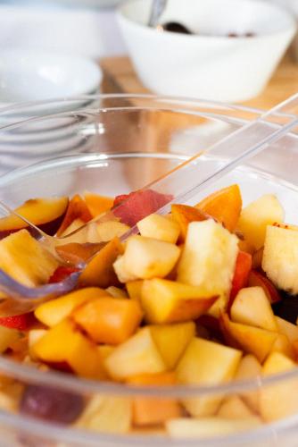 a plastic container filled with apples and other vegetables at Hotel De Nac in Nago-Torbole