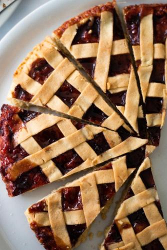 a plate with a slice of pie with a knife at Hotel De Nac in Nago-Torbole