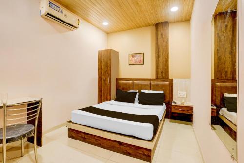 Ένα ή περισσότερα κρεβάτια σε δωμάτιο στο Hotel O Tawakkal Guest house