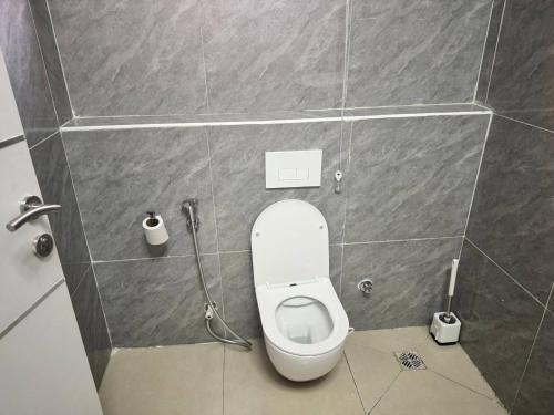 a bathroom with a toilet in a stall at Serene Oasis in Lagos - Private Pool Relaxing Ambiance in Lagos