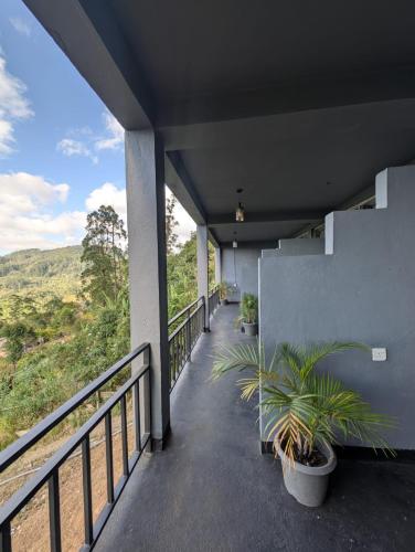 a balcony of a house with plants on it at White Lotus Haputale in Haputale