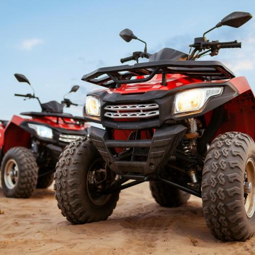 two atvs parked on a dirt road at Abu Dhabi Overnight Desert Safari in Sabkhah