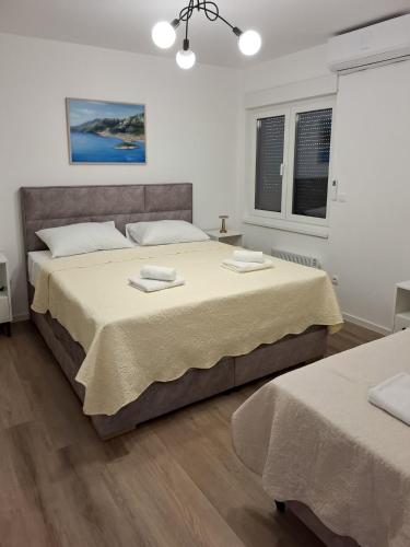 Katil atau katil-katil dalam bilik di Apartman Marta Makarska - 1 kat